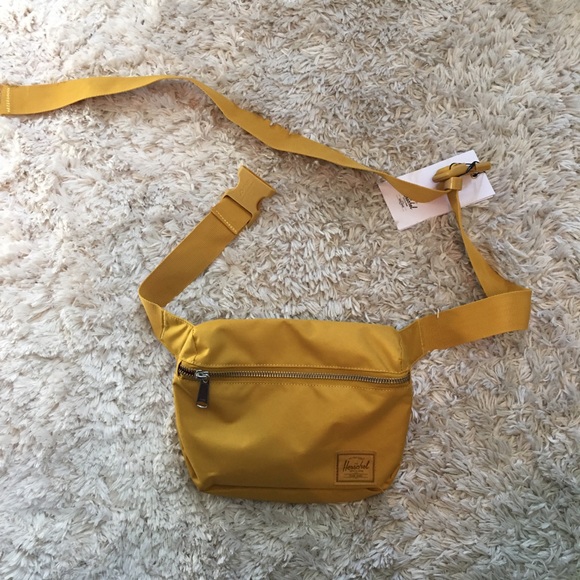 Urban Outfitters Handbags - herschel yellow fanny pack